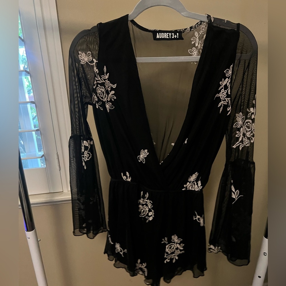 Black with white flowers Romper.  Size medium.